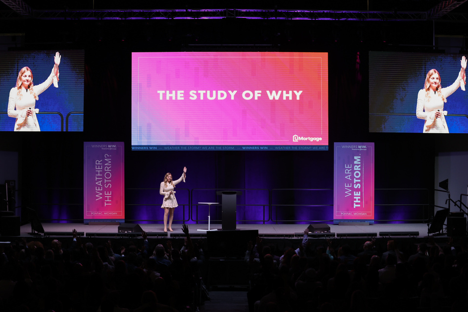 Corie Meredith delivering a keynote, The Study of Why
